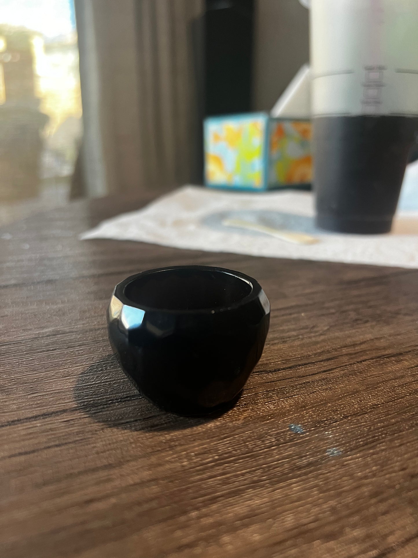 Small 1 inch high by 1 1/2 inch wide Black bowl.